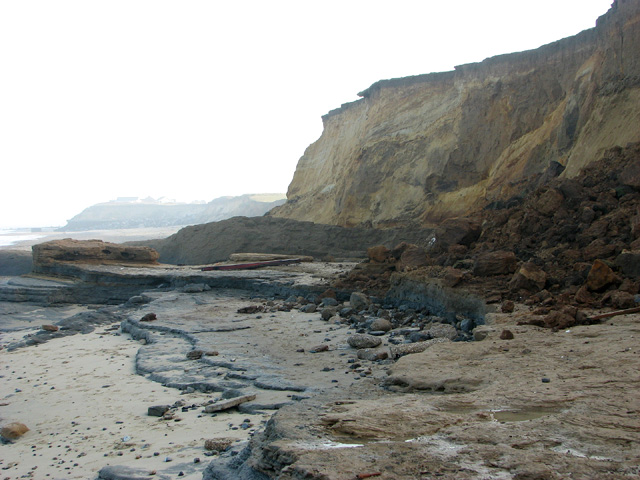 Cliff slumping down onto the beach and into the sea at Happisburgh. This can be caused by coastal flooding and erosion. 