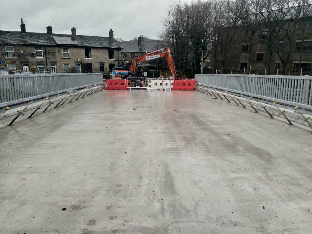 Photo showing the concrete added to the bridge structure